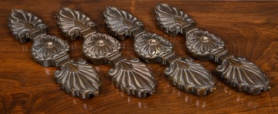 Lot 314 - A set of four early 19th century bronze mounts,...