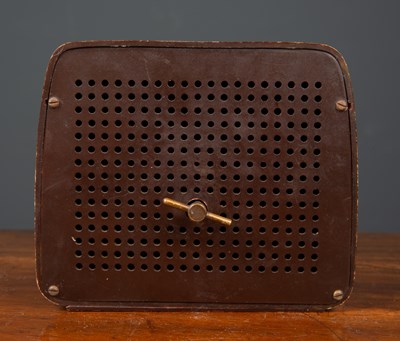 Lot 85 - A 1950's Bakelite TV wind-up music box, the...