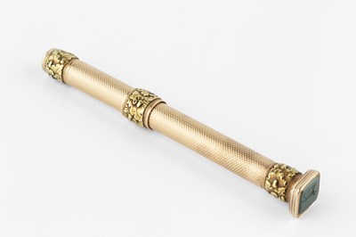 Lot 561 - A two-colour gold propelling pencil, with...