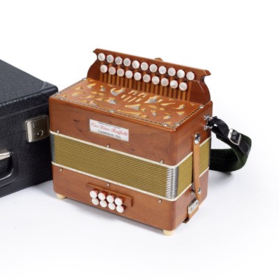 Lot 115 - A Cav. Dino Baffetti melodeon with fretted end...