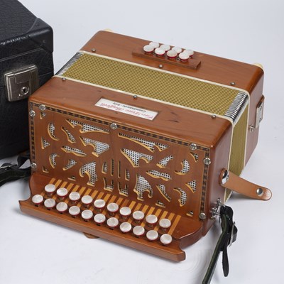 Lot 115 - A Cav. Dino Baffetti melodeon with fretted end...
