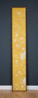 Lot 104 - A painted canvas wall hanging in giltwood...