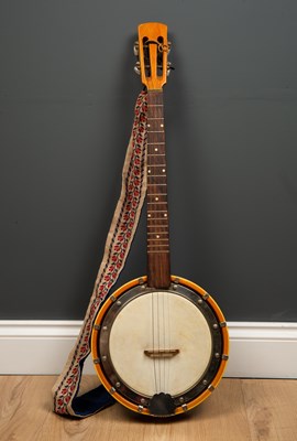 Lot 429 - A four string banjo, with tapestry decorated...