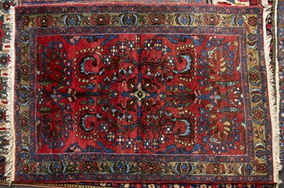 Lot 601 - A mid 20th century Middle Eastern red ground...