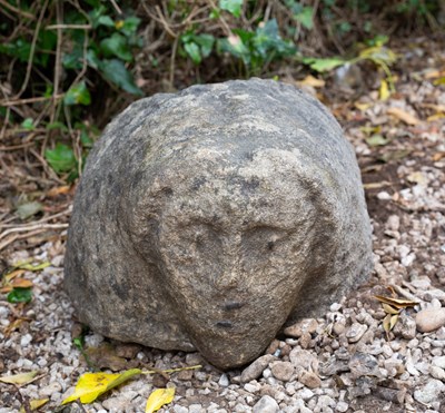 Lot 659 - An ancient Celtic stone head, carved in...