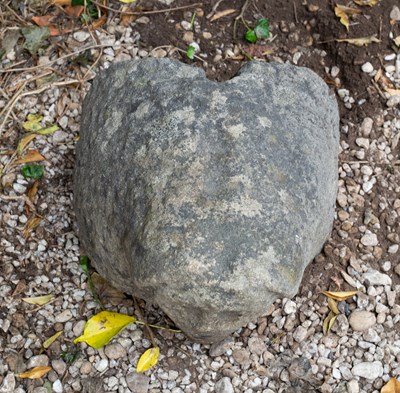 Lot 659 - An ancient Celtic stone head, carved in...