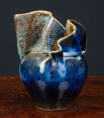 Lot 255 - An abstract form baluster clay vase with...