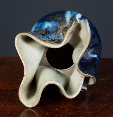 Lot 255 - An abstract form baluster clay vase with...