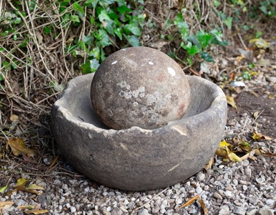 Lot 660 - An ancient mortar stone and spherical...