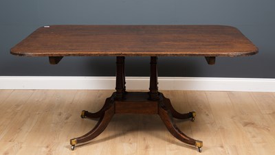Lot 334 - A 19th century mahogany tilt top dining table...