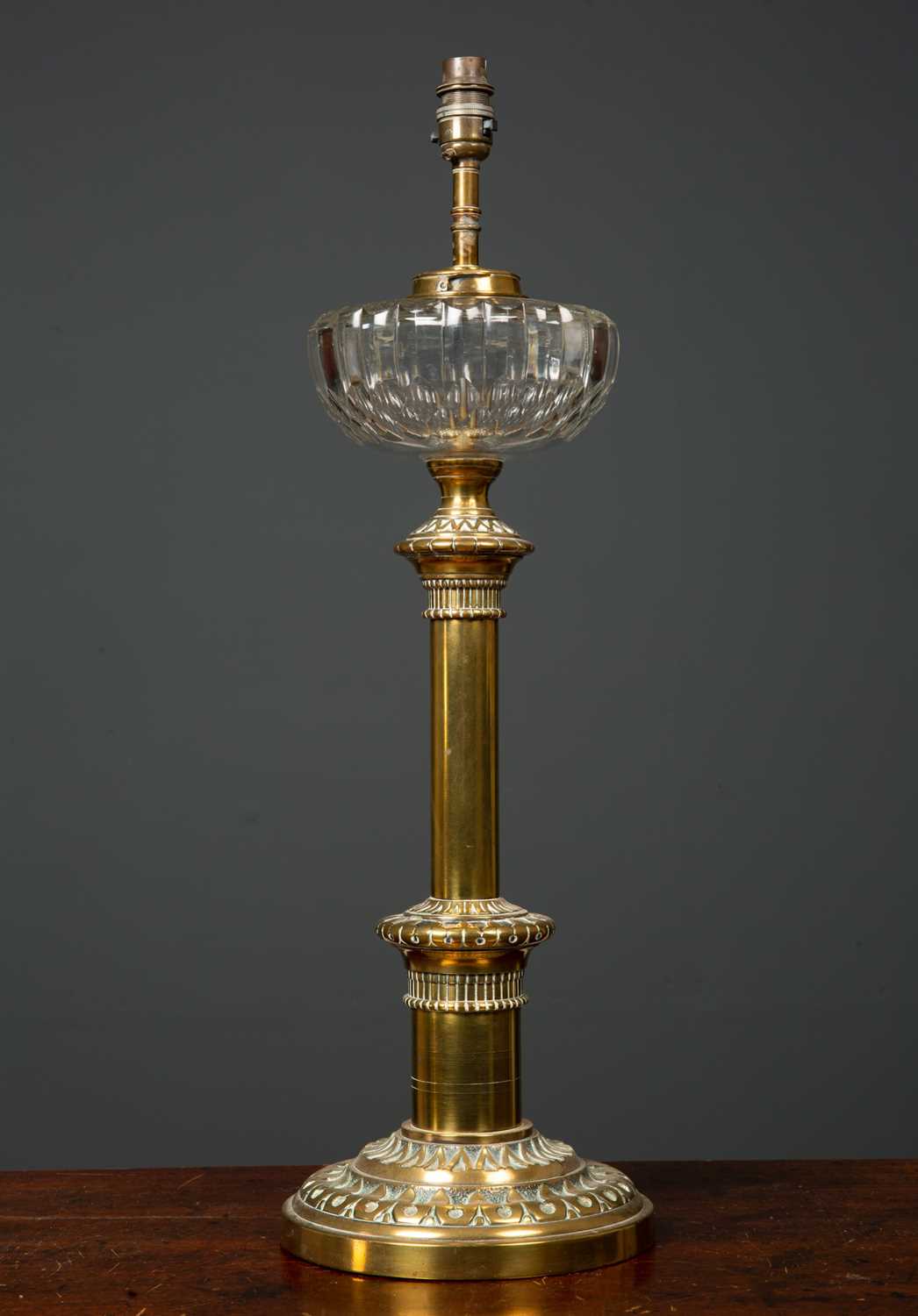 Lot 28 - A Victorian brass based oil lamp with cut...