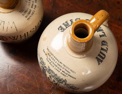 Lot 12 - A Victorian stoneware whiskey jar by H Kennedy...