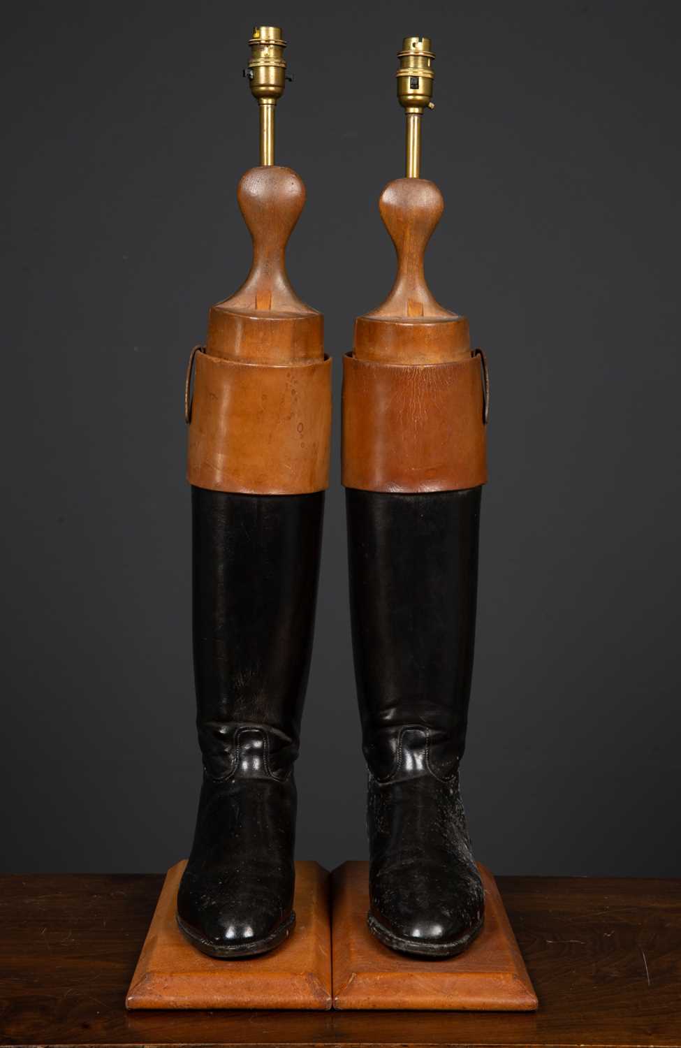 Lot 21 - A pair of table lamps constructed from brown...