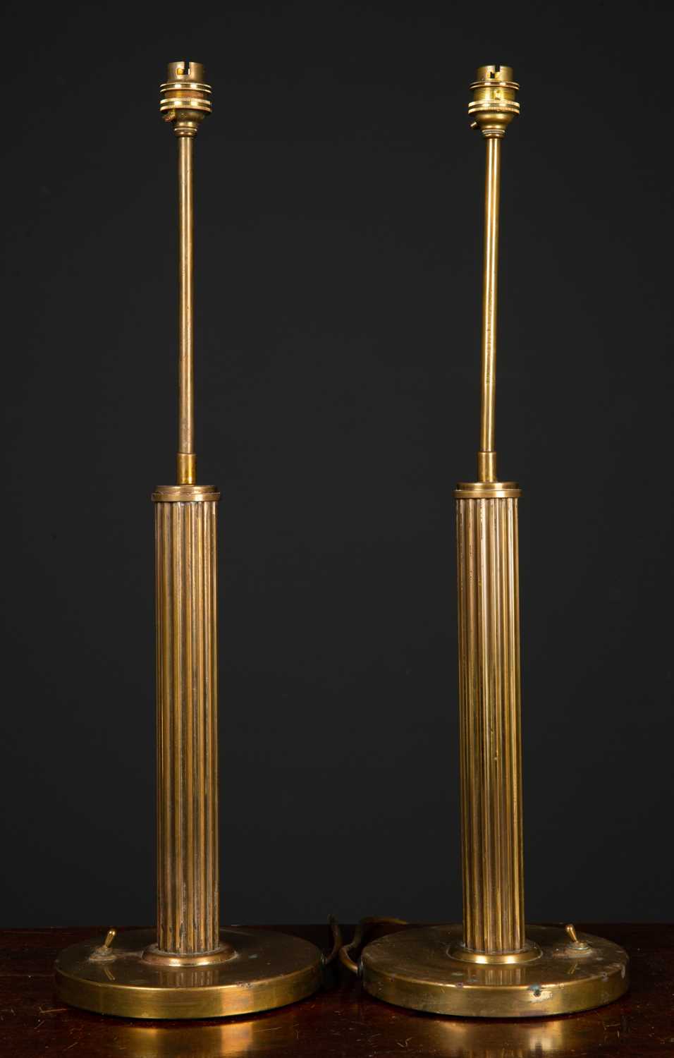Lot 13 - A pair of circular brass table lamps with...