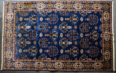 Lot 617 - An Eastern blue ground carpet with geometric...