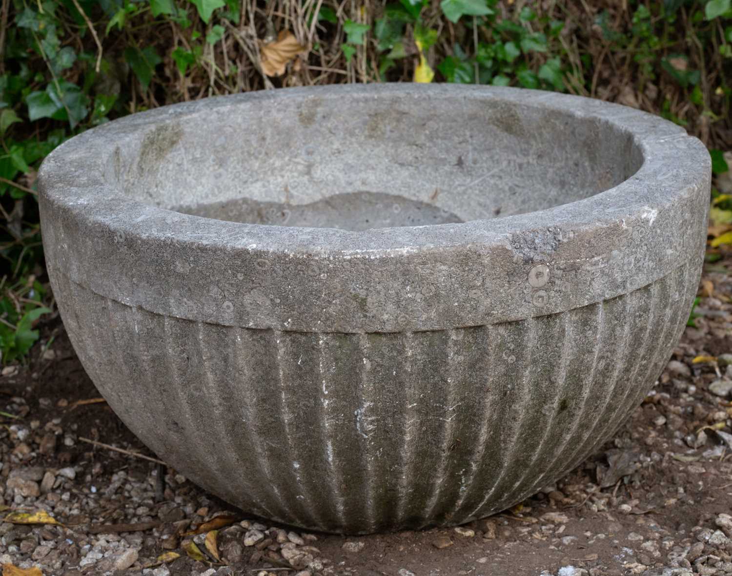 Lot 666 - An Early English carved stone font, The fluted...