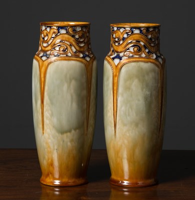 Lot 321 - A pair of Royal Doulton stoneware tall vases,...