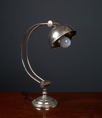 Lot 482 - An adjustable white metal table lamp with...