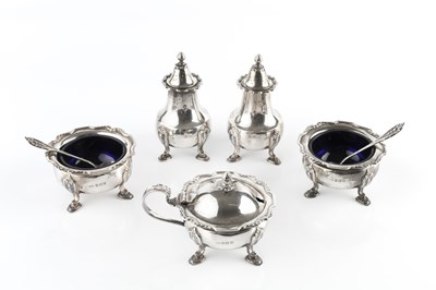 Lot 857 - A silver five piece cruet set, comprising a...