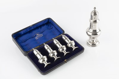 Lot 861 - A set of four Edwardian silver baluster pepper...