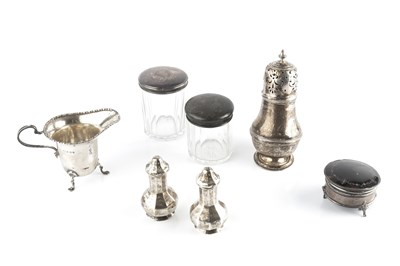 Lot 862 - A collection of silver, comprising a cream jug...