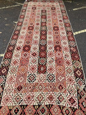 Lot 628 - An early 20th century Kelim rug in green, red...