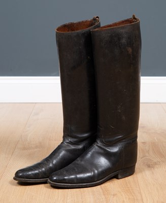 Lot 245 - A pair of black leather riding boots 44cm high...