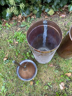 Lot 553 - A copper rain gauge with brass rim, 13cm...