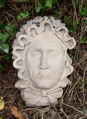 Lot 672 - A carved stone sculpture of a witches head...