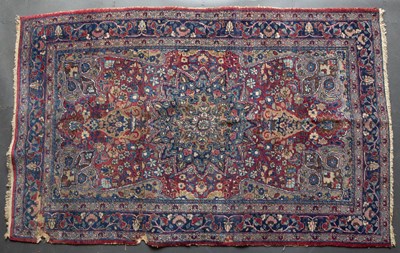 Lot 625 - An Eastern blue and red ground rug with...