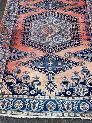 Lot 631 - An Afghan red and blue ground rug with...