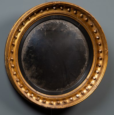 Lot 439 - A Regency circular giltwood convex wall mirror,...