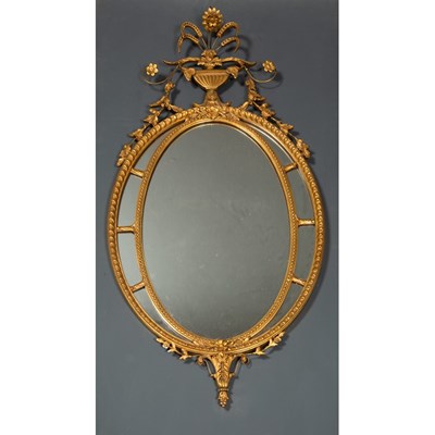 Lot 183 - An Adam's style gilded gesso oval wall mirror,...