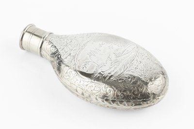 Lot 568 - A mid Victorian silver flask, of shaped oval...