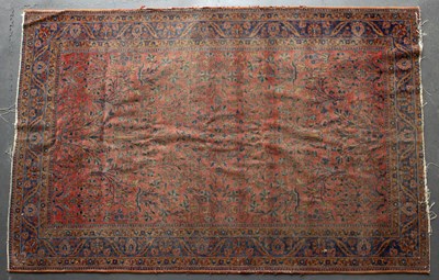 Lot 635 - An early 20th century Sarouk red ground rug...