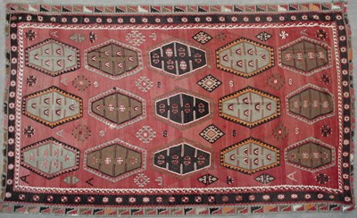 Lot 636 - An antique Kelim carpet with fifteen central...