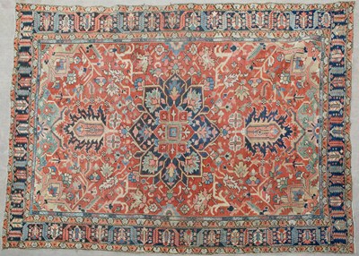 Lot 637 - A Persian multicoloured carpet with geometric...