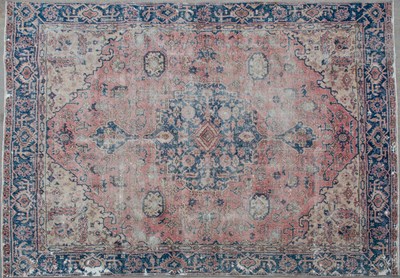 Lot 644 - A 20th century blue and pink ground carpet...