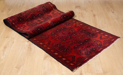 Lot 649 - A modern red ground Oriental runner with six...