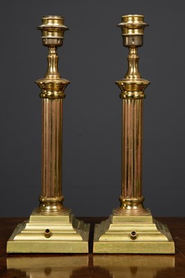 Lot 349 - A pair of brass table lamps, the fluted column...