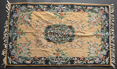 Lot 650 - A woollen tapestry with foliate decoration,...