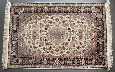 Lot 654 - An Eastern cream ground rug with stylised...