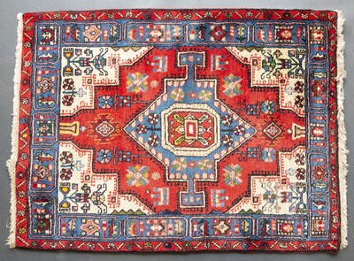 Lot 658 - A Middle Eastern red, blue and white ground...