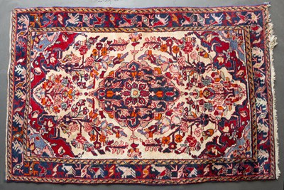 Lot 665 - A late 20th century Middle Eastern woollen rug...