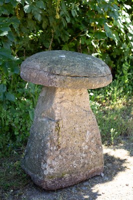 Lot 674 - An old staddle stone with circular top and...