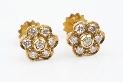 Lot 125 - A pair of diamond cluster ear studs, each...