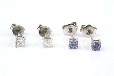 Lot 93 - A pair of diamond single stone ear studs, each...