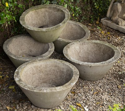 Lot 655 - A set of five cast concrete conical planters...