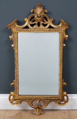 Lot 437 - A Georgian-style giltwood carved mirror, the...