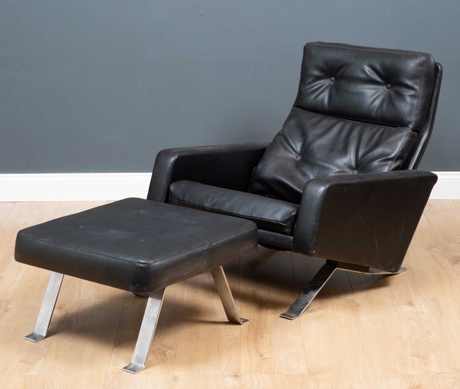 Lot 94 - A Robin Day Leo black leather low armchair and...